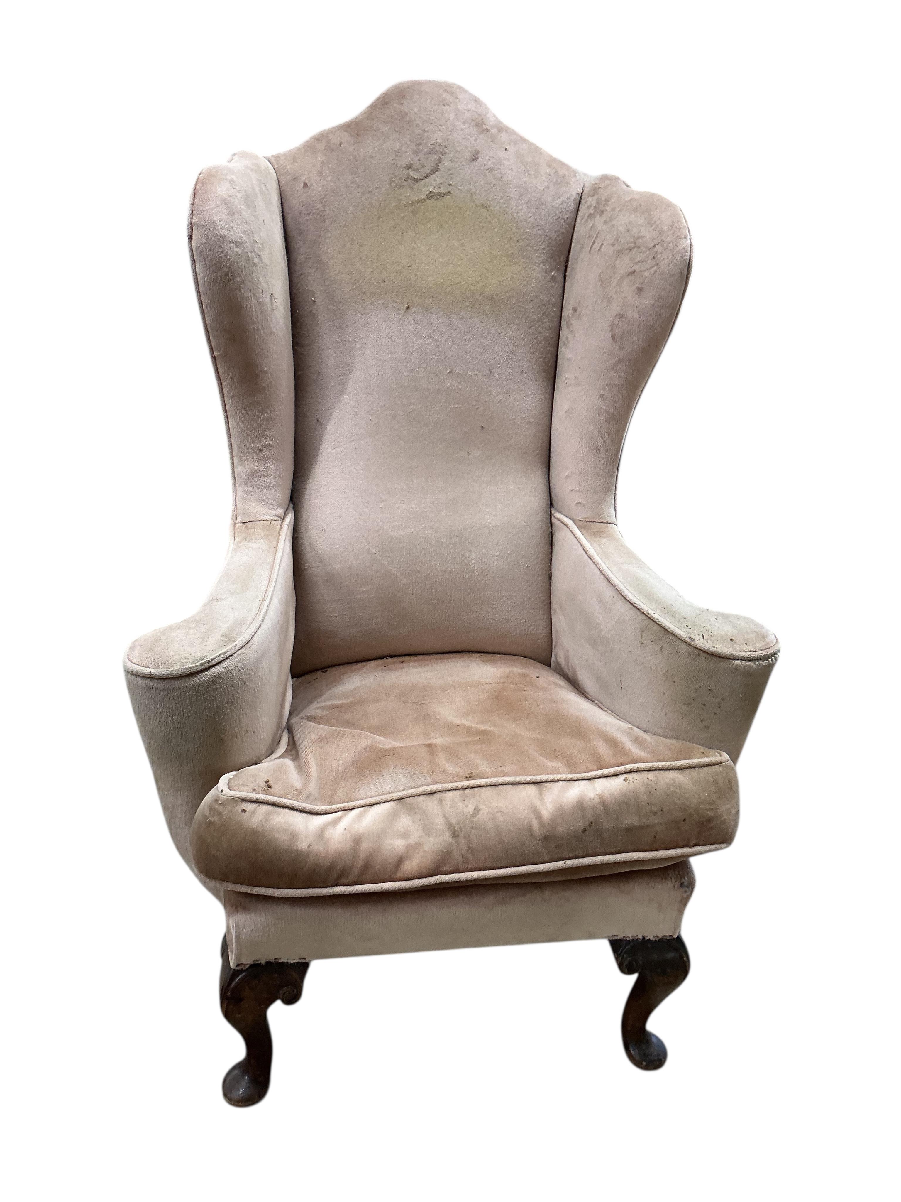 A Queen Anne Revival upholstered wing armchair, width 79cm, depth 60cm, height 116cm